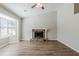 Spacious living room features hardwood floors, a stone fireplace, and a large window at 2419 Leslie Brook Dr, Decatur, GA 30035