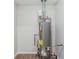 A modern gray water heater sits on a wood-look floor at 2419 Leslie Brook Dr, Decatur, GA 30035