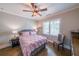 This bedroom features a ceiling fan, neutral paint, and lots of natural light at 405 Grafton Walk, Woodstock, GA 30188