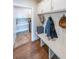 Inviting mudroom boasts custom storage with bench seating, cabinets, and coat hooks for organization at 405 Grafton Walk, Woodstock, GA 30188