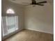 Bedroom features wood-look floors, modern ceiling fan and large window at 5611 Executive Way, Norcross, GA 30071
