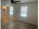 Bright bedroom features wood-look floors, modern ceiling fan and closet at 5611 Executive Way, Norcross, GA 30071