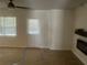 Cozy living room features wood-look floors, electric fireplace and large window at 5611 Executive Way, Norcross, GA 30071