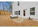 Backyard featuring a concrete patio, outdoor seating, and a fenced yard at 114 Green Tree Ct, Dacula, GA 30019