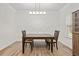 Dining room featuring modern light fixture, wainscoting and neutral decor at 114 Green Tree Ct, Dacula, GA 30019