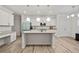 Bright kitchen with white cabinets, granite countertops, and stainless steel appliances at 114 Green Tree Ct, Dacula, GA 30019