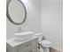 Modern powder room with a vessel sink, stylish vanity, and sleek fixtures at 114 Green Tree Ct, Dacula, GA 30019