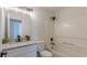 Bright bathroom featuring vanity with granite counters, shower and tub combo at 2724 Kristen Ct, Conyers, GA 30012