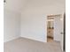 Bedroom featuring carpeted floors and a doorway to the bathroom at 2724 Kristen Ct, Conyers, GA 30012