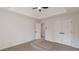 This bedroom features neutral walls, carpet, a closet, and a ceiling fan at 2724 Kristen Ct, Conyers, GA 30012