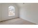 Neutral bedroom with carpet and a large window at 2724 Kristen Ct, Conyers, GA 30012