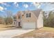 Inviting home with brick and vinyl siding, attached two-car garage, and well-maintained landscaping at 2724 Kristen Ct, Conyers, GA 30012