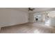 Bright and airy living room with neutral carpeting and view to the white kitchen at 2724 Kristen Ct, Conyers, GA 30012