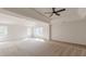 Bright main bedroom featuring carpet, vaulted ceilings, ceiling fan, and large windows at 2724 Kristen Ct, Conyers, GA 30012