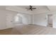 Spacious main bedroom features a ceiling fan, and multiple doors at 2724 Kristen Ct, Conyers, GA 30012