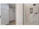 Walk-in closet with wire shelving and door to bathroom with tiled shower at 2724 Kristen Ct, Conyers, GA 30012