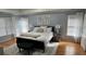 Spacious main bedroom with a bed and many windows at 4107 Suwanee Trail Way, Buford, GA 30518