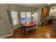 Eat-in kitchen nook with seating area and sliding glass doors to the backyard at 4107 Suwanee Trail Way, Buford, GA 30518