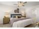 Cozy bedroom featuring ceiling fan and a large bed with throw pillows at 9458 Cedar Grove Ct # 330, Jonesboro, GA 30238