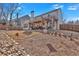 Expansive backyard featuring a covered patio with pergola, ideal for outdoor entertaining at 203 Roseman Way, Woodstock, GA 30188