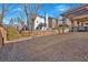Backyard featuring a covered patio, wooden fence, well maintained lawn, and surrounding trees at 203 Roseman Way, Woodstock, GA 30188