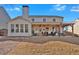 Spacious backyard with a covered patio and pergola, perfect for relaxing and enjoying the outdoors at 203 Roseman Way, Woodstock, GA 30188