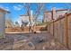 Fenced backyard offering privacy, featuring mature trees and a peaceful outdoor space at 203 Roseman Way, Woodstock, GA 30188