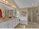 Spa-like bathroom features double sinks, soaking tub and glass enclosed shower at 203 Roseman Way, Woodstock, GA 30188