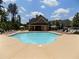 Beautiful community pool surrounded by lounge chairs, providing a perfect spot for recreation at 203 Roseman Way, Woodstock, GA 30188
