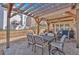 Inviting covered patio with stylish furniture, providing a comfortable outdoor living space at 203 Roseman Way, Woodstock, GA 30188