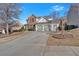 Well-manicured lawn showcasing a traditional-style home with a brick and siding exterior and driveway at 203 Roseman Way, Woodstock, GA 30188