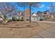 Traditional home with a brick and siding exterior, complemented by a neat lawn and landscaping at 203 Roseman Way, Woodstock, GA 30188
