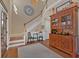Stunning foyer with high ceilings, hardwood floors, grand staircase, and decorative furniture at 203 Roseman Way, Woodstock, GA 30188