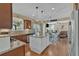 This kitchen features granite countertops, stainless steel appliances, and an open floor plan at 203 Roseman Way, Woodstock, GA 30188