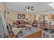 Spacious living room with hardwood floors, comfortable seating, and an open layout to the kitchen at 203 Roseman Way, Woodstock, GA 30188