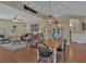 Open-concept living space with dining area that flows into the living room at 203 Roseman Way, Woodstock, GA 30188