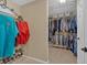 Walk-in closet featuring ample hanging space, wire shelving, and organized clothing and shoe storage at 203 Roseman Way, Woodstock, GA 30188
