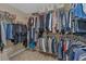 Spacious walk-in closet with clothing racks and storage, offering ample space for organization and storage at 203 Roseman Way, Woodstock, GA 30188
