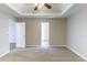 Bright bedroom featuring neutral walls and carpet, with views to other rooms at 5193 Seaside Ct, Atlanta, GA 30349