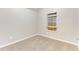 A carpeted bedroom with neutral paint and one window at 5193 Seaside Ct, Atlanta, GA 30349