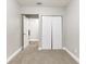 Bedroom featuring carpet, neutral walls, closet, and entry to additional rooms at 5193 Seaside Ct, Atlanta, GA 30349
