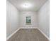 A carpeted bedroom with neutral paint and one window at 5193 Seaside Ct, Atlanta, GA 30349