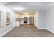 Open-concept area featuring the kitchen with white cabinets, stainless appliances, and the living room area at 5193 Seaside Ct, Atlanta, GA 30349