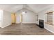Spacious living room featuring a fireplace, ceiling fan and new laminated wood flooring at 5193 Seaside Ct, Atlanta, GA 30349