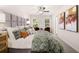 Serene main bedroom with plush bedding, stylish decor, and plenty of natural light at 9460 Cedar Grove Ct # 329, Jonesboro, GA 30238