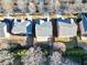 An aerial view shows homes with well-kept yards and tree coverage in a suburban neighborhood at 120 Daniel Creek Ln, Sugar Hill, GA 30518