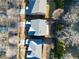 An aerial view of the neighborhood showcasing the rooftops and well-maintained yards on a sunny day at 120 Daniel Creek Ln, Sugar Hill, GA 30518