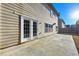 Back of home featuring double doors and concrete patio at 120 Daniel Creek Ln, Sugar Hill, GA 30518