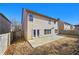 Back of home featuring double doors and concrete patio at 120 Daniel Creek Ln, Sugar Hill, GA 30518