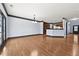 Spacious dining room with hardwood floors and view of kitchen at 120 Daniel Creek Ln, Sugar Hill, GA 30518